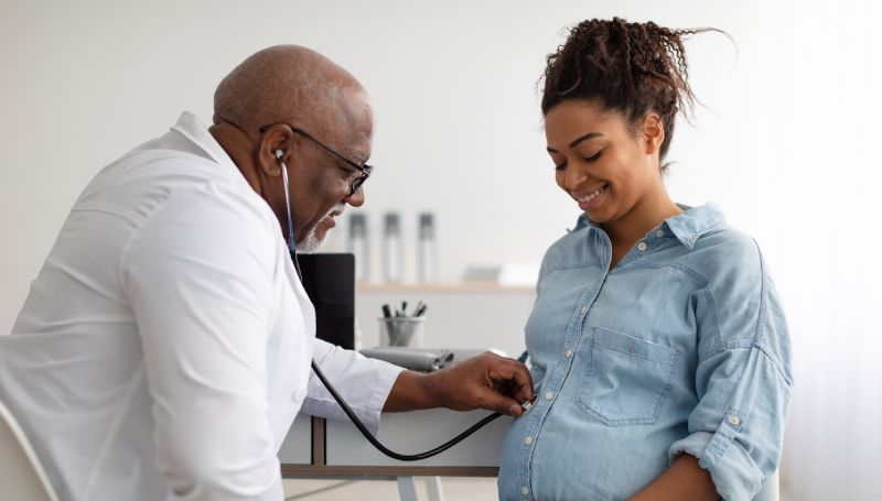 pregnant woman being examined by doctor