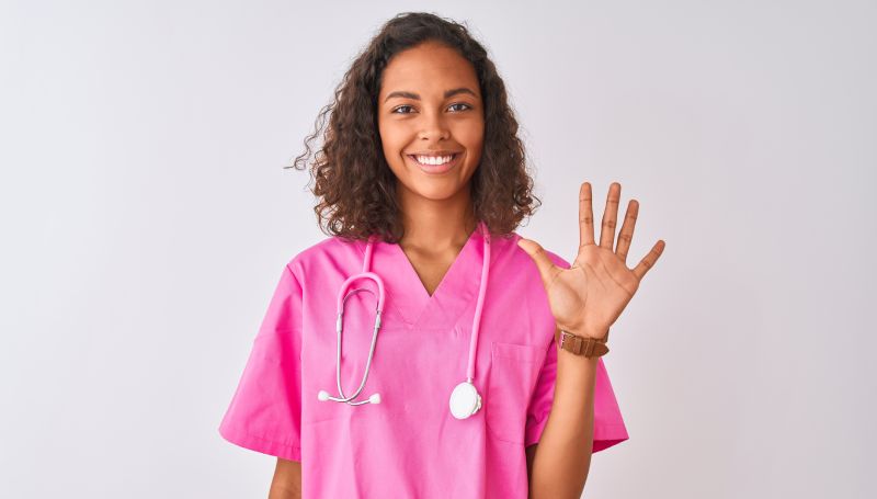 nurse holding up five fingers